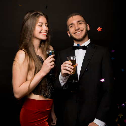 imgi_20_smiling-man-woman-dinner-jacket-evening-wear-with-glasses-drinks-near-confetti_23-2147989310-e1770787591694.png